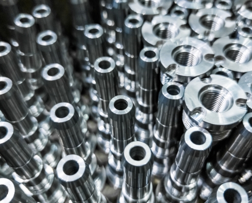 Shiny Steel Parts Close Up Background, Long Clean Steel Rods After Fine Cnc Turning