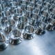 Shiny Metal Aerospace Parts After Cnc Machining On Steel Surface With Selective Focus, Industrial Background