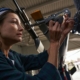 Worker Measuring Parts On Plane