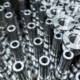 Shiny Steel Parts Close Up Background, Long Clean Steel Rods After Fine Cnc Turning